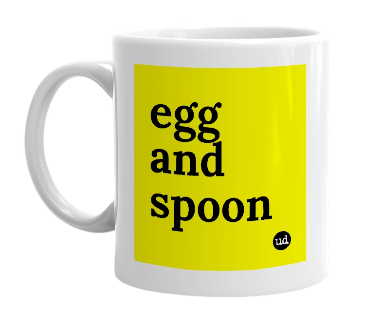 White mug with 'egg and spoon' in bold black letters
