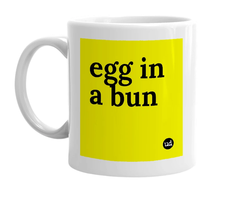 White mug with 'egg in a bun' in bold black letters