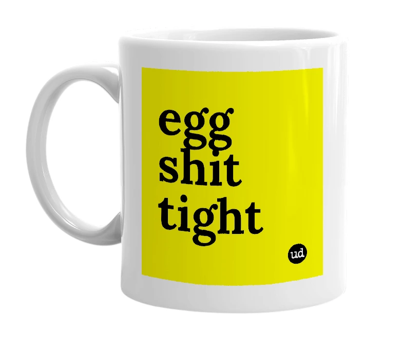White mug with 'egg shit tight' in bold black letters