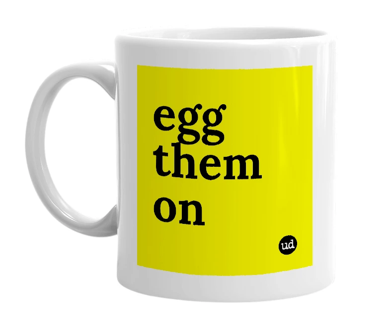 White mug with 'egg them on' in bold black letters