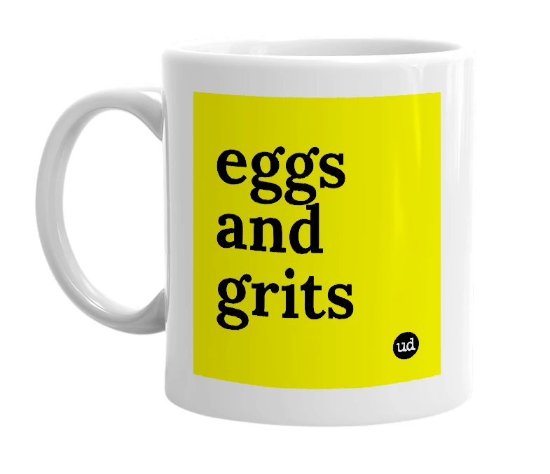 White mug with 'eggs and grits' in bold black letters