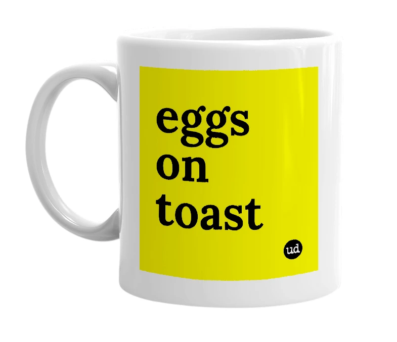 White mug with 'eggs on toast' in bold black letters