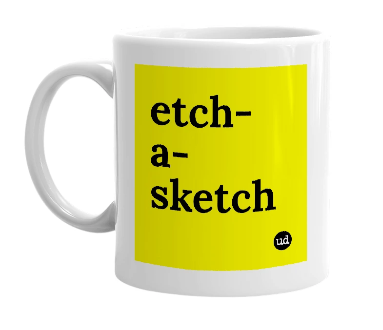 White mug with 'etch-a-sketch' in bold black letters