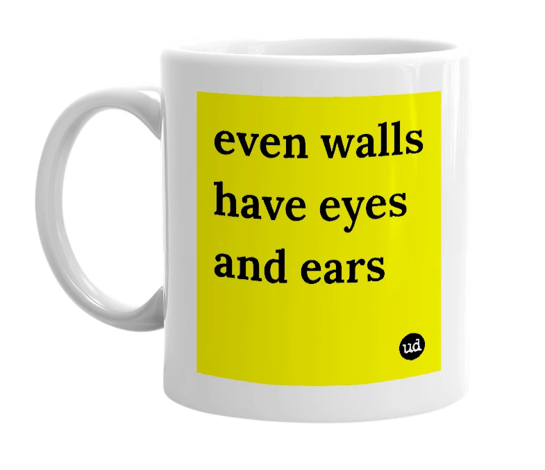 White mug with 'even walls have eyes and ears' in bold black letters