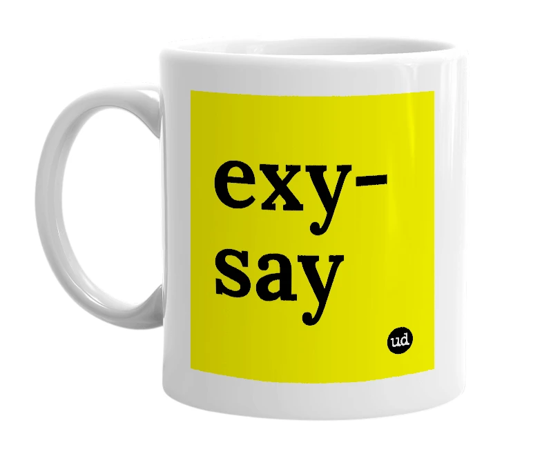 White mug with 'exy-say' in bold black letters