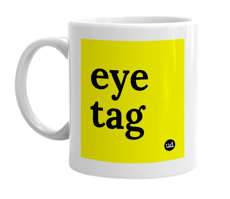 White mug with 'eye tag' in bold black letters