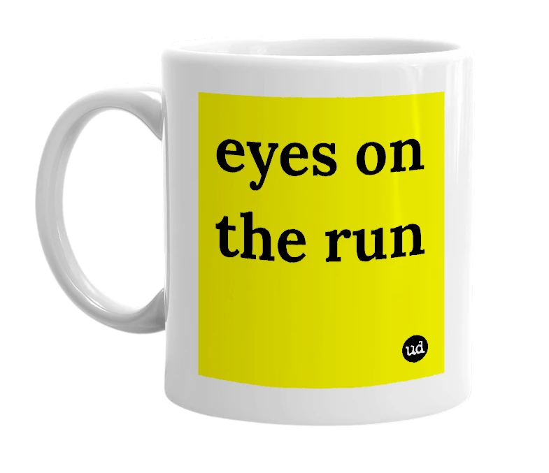 White mug with 'eyes on the run' in bold black letters