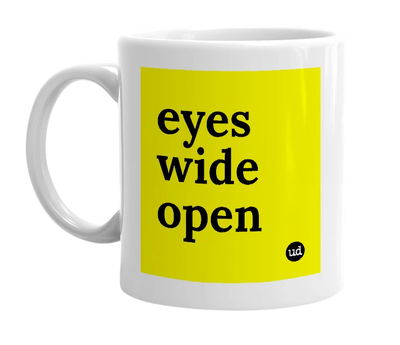 White mug with 'eyes wide open' in bold black letters