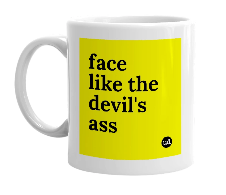 White mug with 'face like the devil's ass' in bold black letters