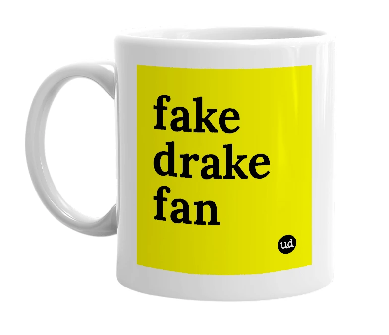 White mug with 'fake drake fan' in bold black letters