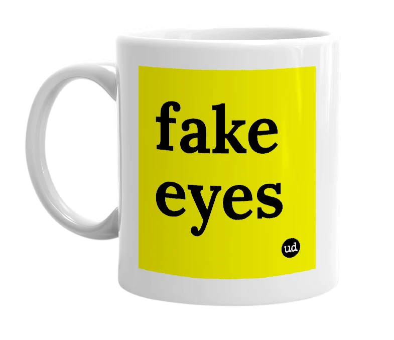 White mug with 'fake eyes' in bold black letters