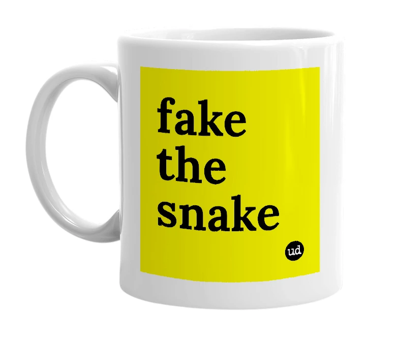 White mug with 'fake the snake' in bold black letters