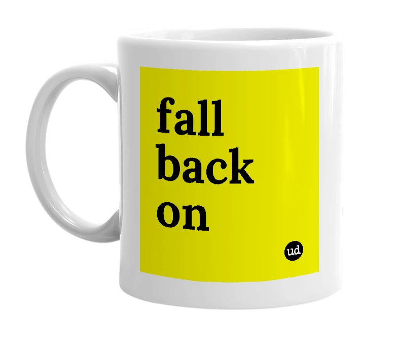 White mug with 'fall back on' in bold black letters