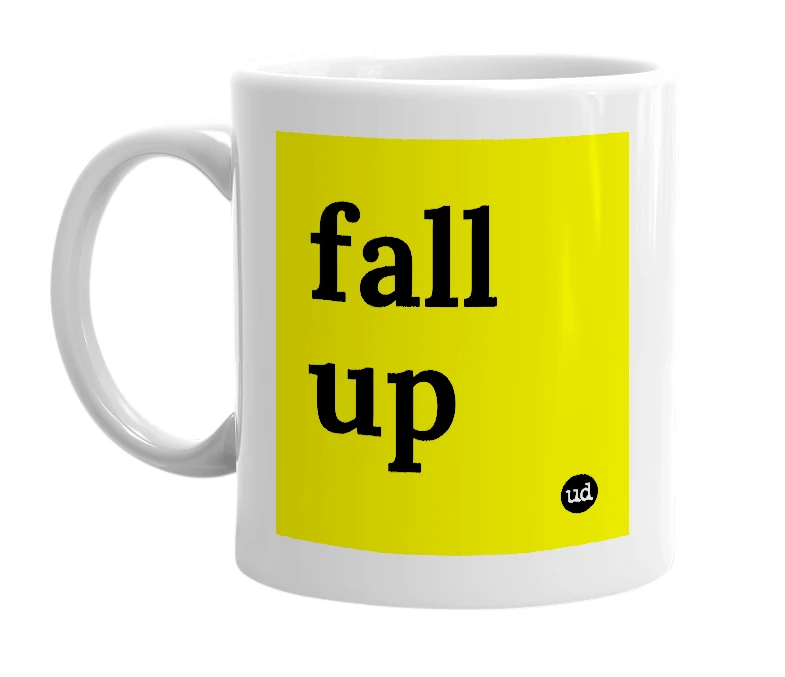 White mug with 'fall up' in bold black letters