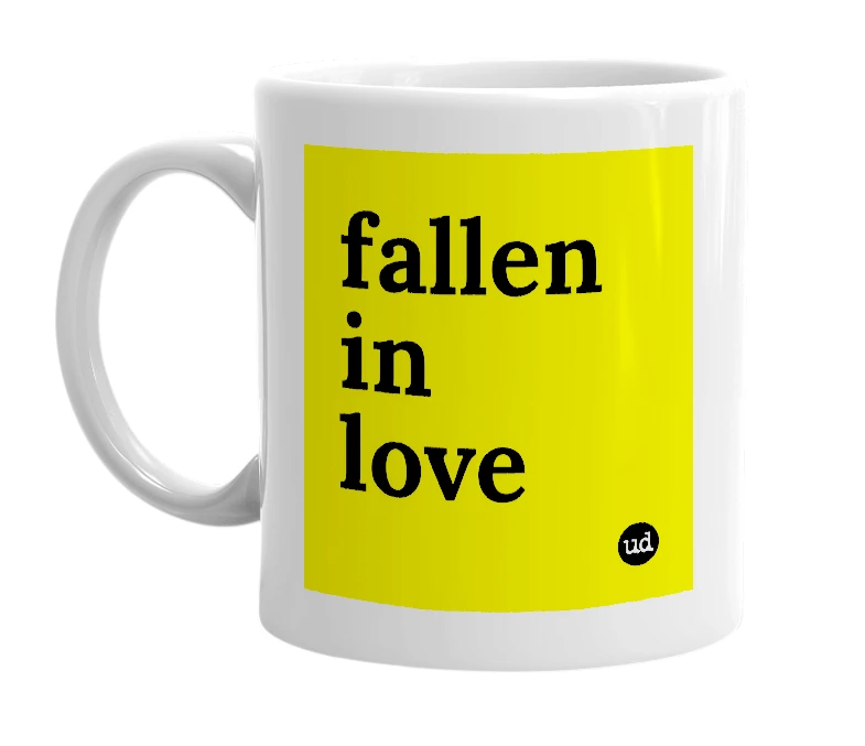 White mug with 'fallen in love' in bold black letters