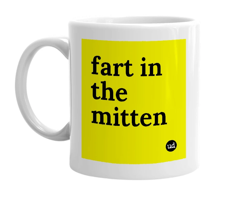 White mug with 'fart in the mitten' in bold black letters