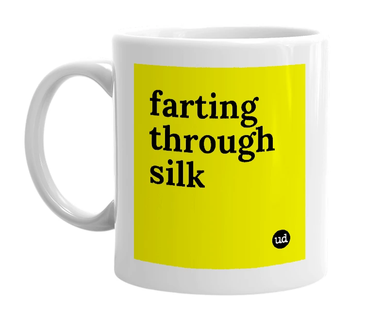 White mug with 'farting through silk' in bold black letters