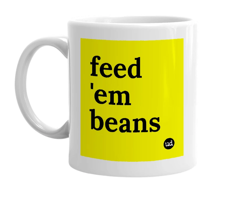 White mug with 'feed 'em beans' in bold black letters