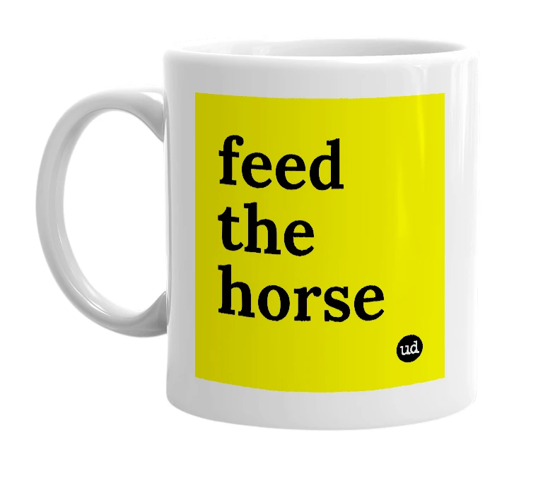 White mug with 'feed the horse' in bold black letters