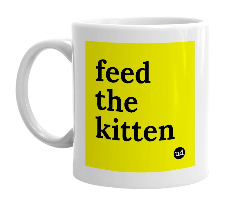 White mug with 'feed the kitten' in bold black letters