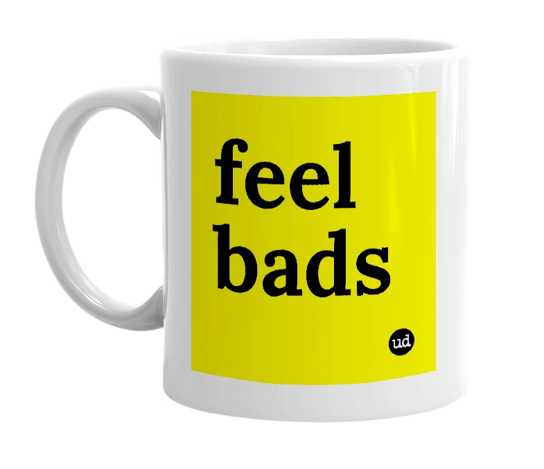 White mug with 'feel bads' in bold black letters