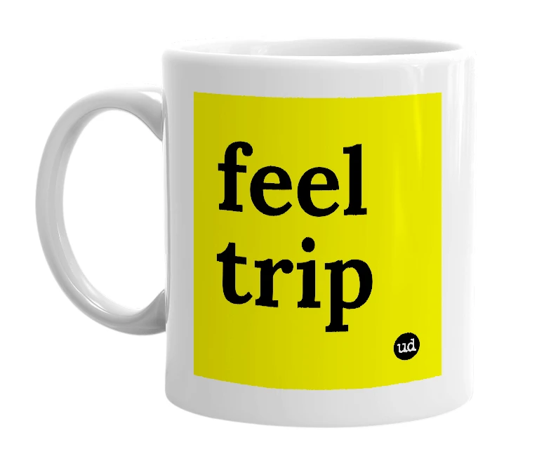 White mug with 'feel trip' in bold black letters