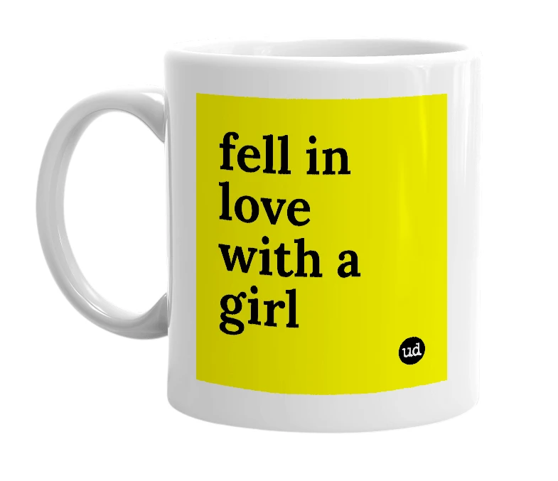 White mug with 'fell in love with a girl' in bold black letters