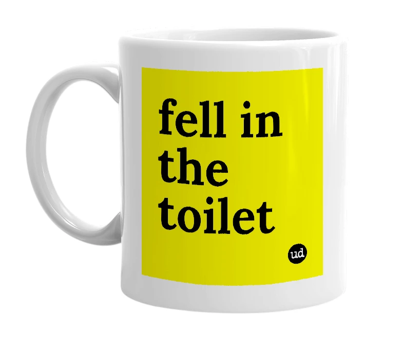 White mug with 'fell in the toilet' in bold black letters