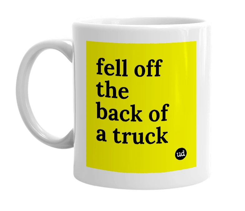 White mug with 'fell off the back of a truck' in bold black letters