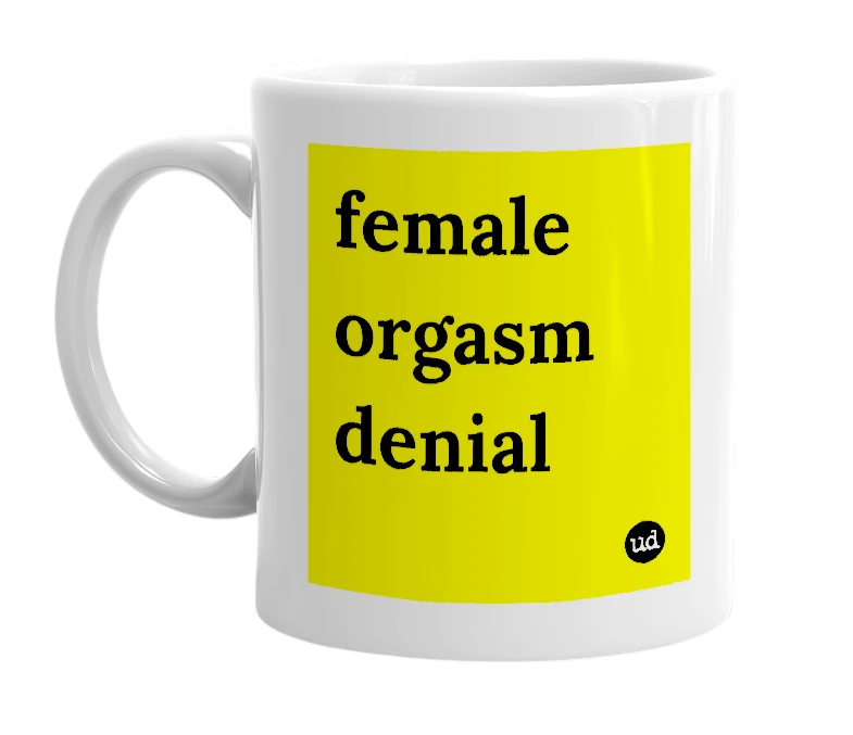 White mug with 'female orgasm denial' in bold black letters