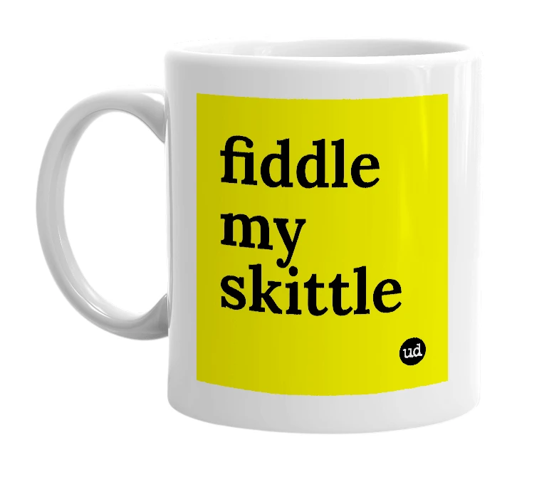 White mug with 'fiddle my skittle' in bold black letters