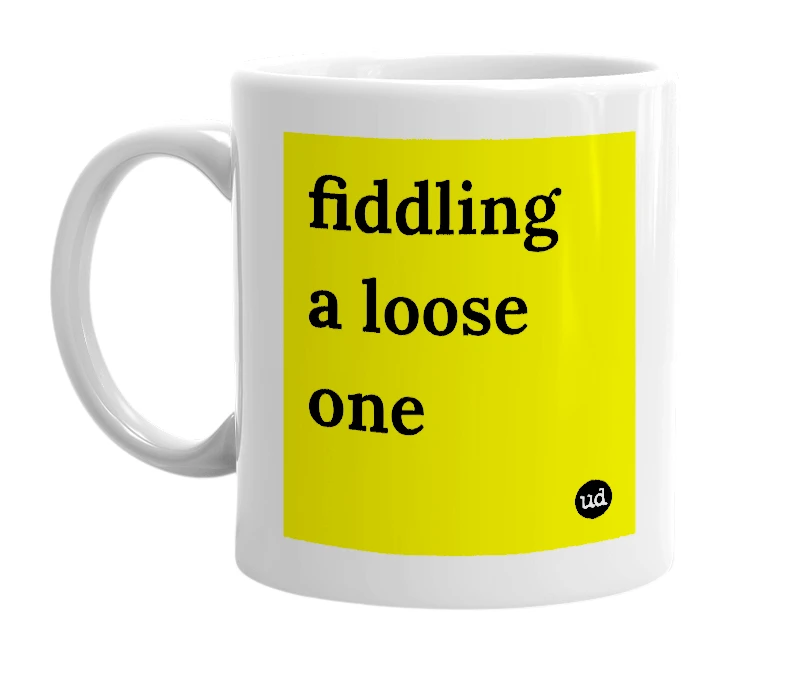 White mug with 'fiddling a loose one' in bold black letters