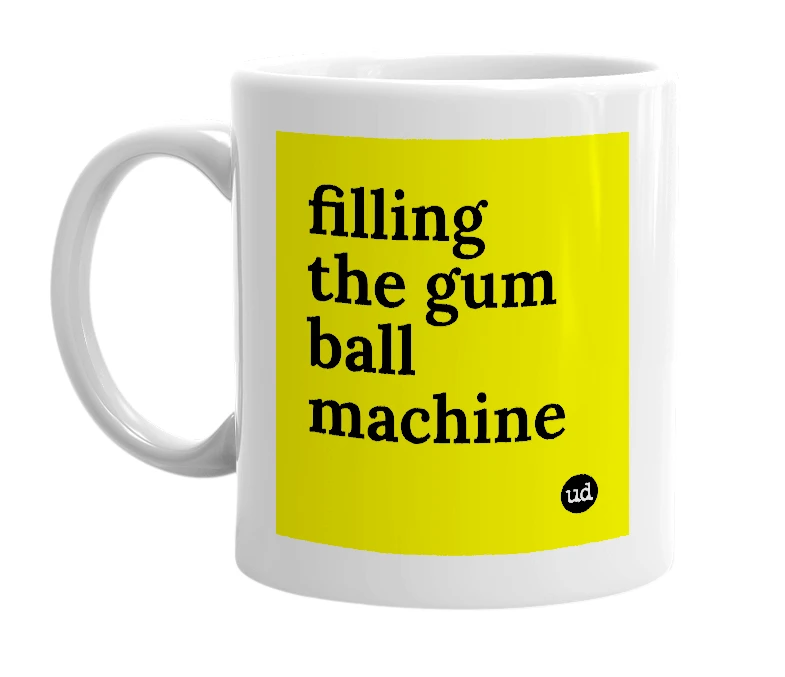 White mug with 'filling the gum ball machine' in bold black letters