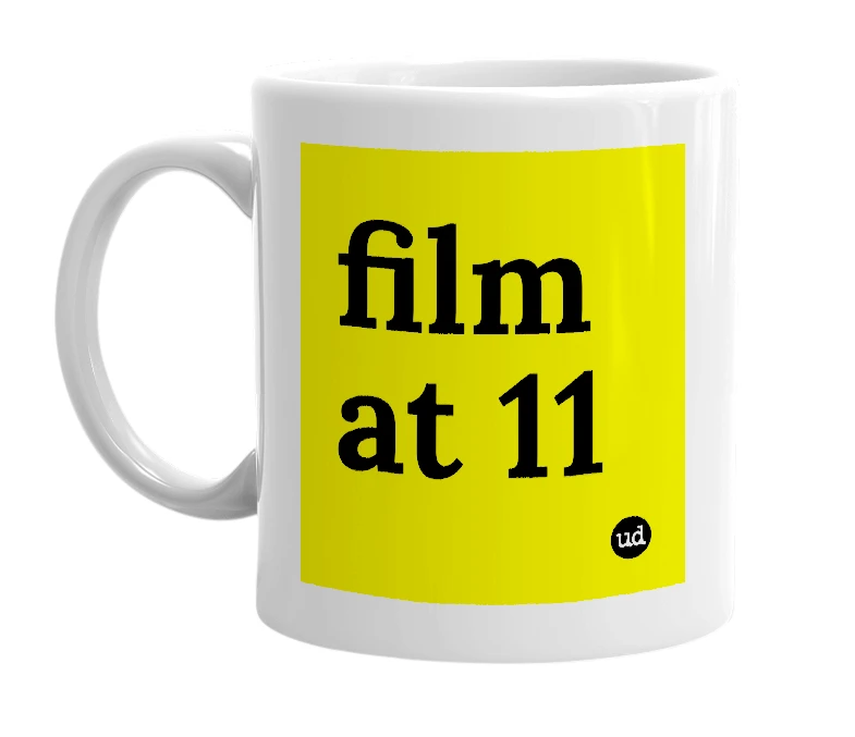 White mug with 'film at 11' in bold black letters