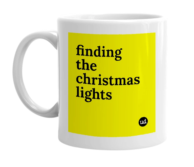 White mug with 'finding the christmas lights' in bold black letters