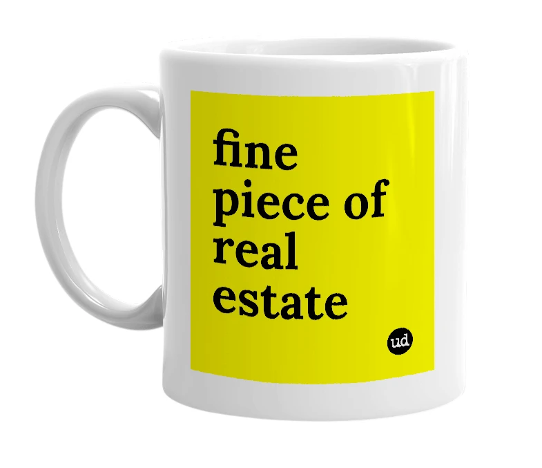 White mug with 'fine piece of real estate' in bold black letters