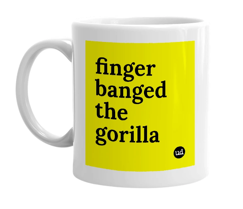 White mug with 'finger banged the gorilla' in bold black letters