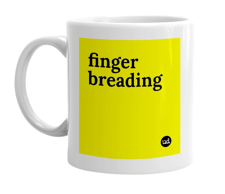 White mug with 'finger breading' in bold black letters
