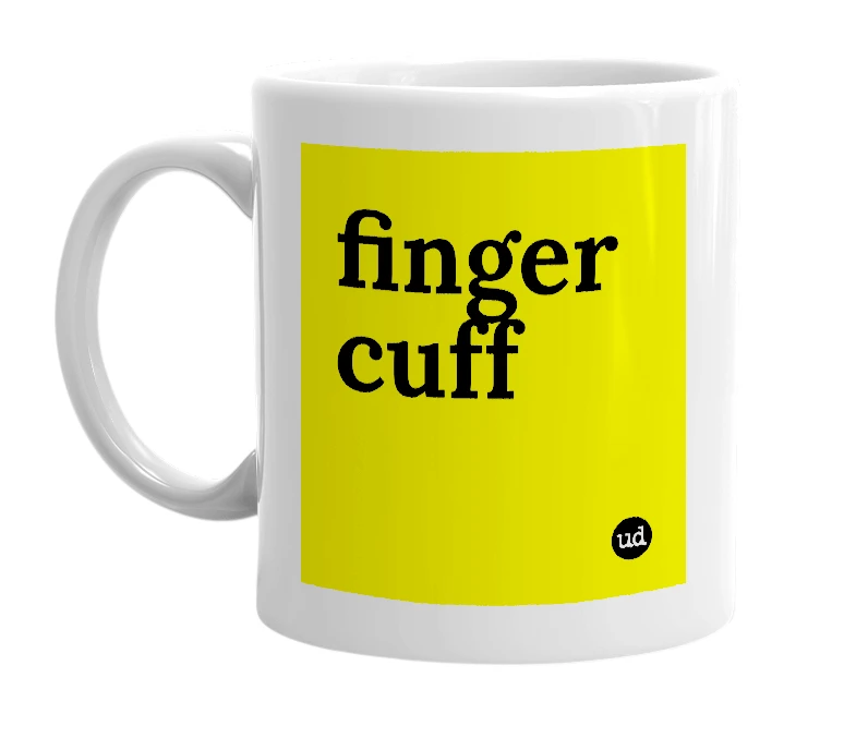 White mug with 'finger cuff' in bold black letters