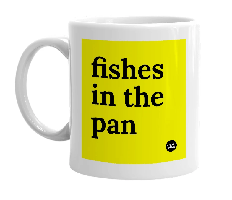 White mug with 'fishes in the pan' in bold black letters