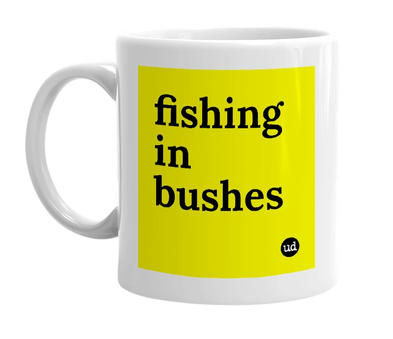 White mug with 'fishing in bushes' in bold black letters