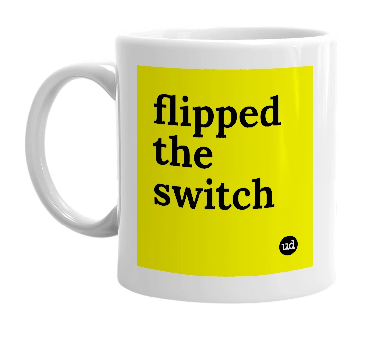 White mug with 'flipped the switch' in bold black letters