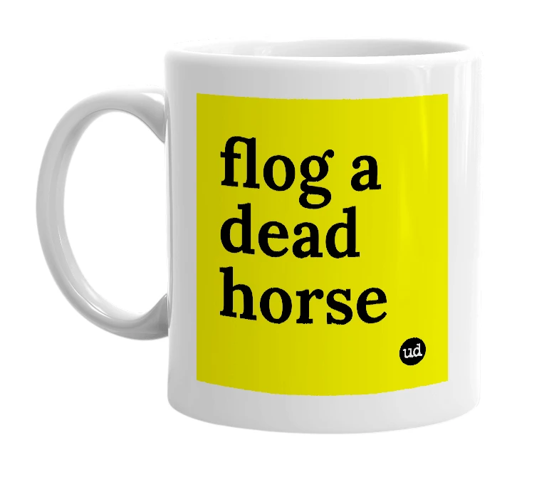 White mug with 'flog a dead horse' in bold black letters