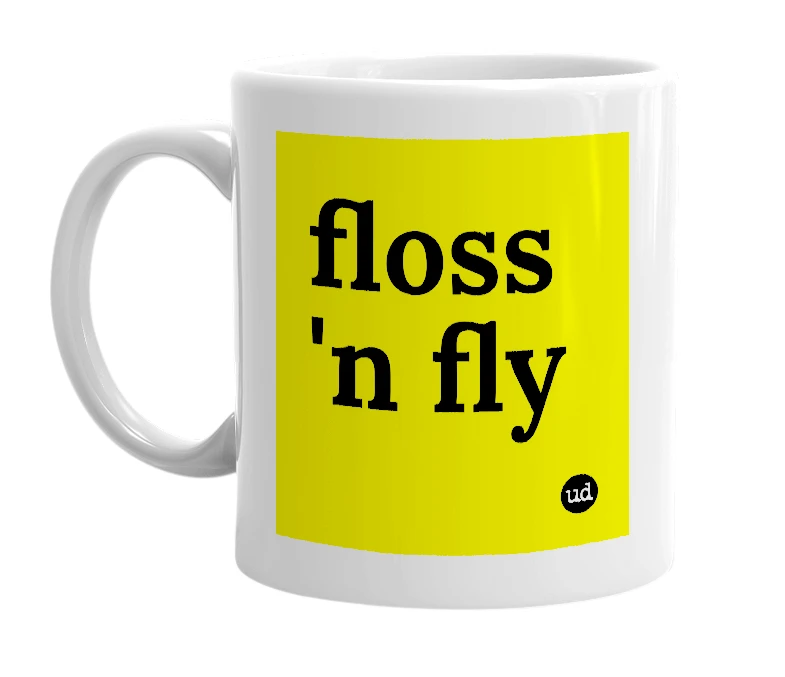 White mug with 'floss 'n fly' in bold black letters