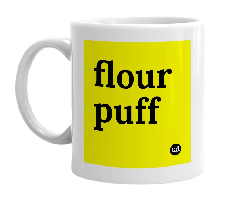 White mug with 'flour puff' in bold black letters
