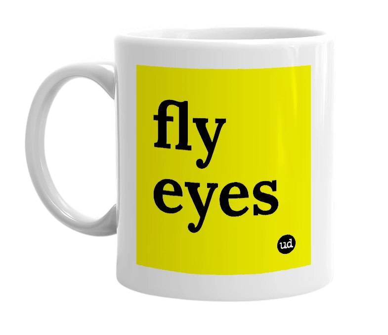 White mug with 'fly eyes' in bold black letters