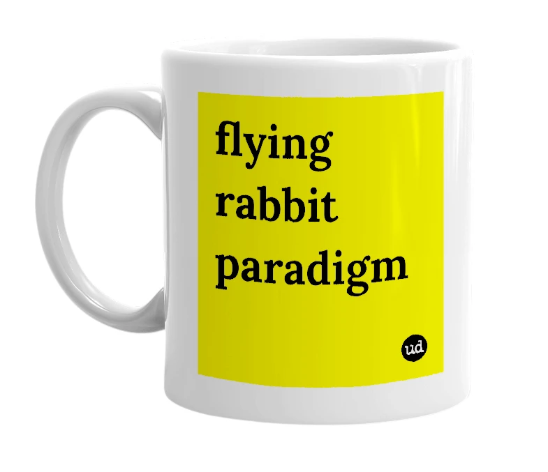 White mug with 'flying rabbit paradigm' in bold black letters