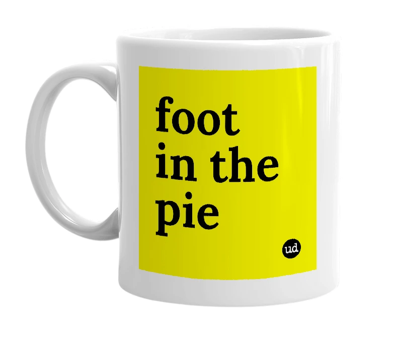 White mug with 'foot in the pie' in bold black letters