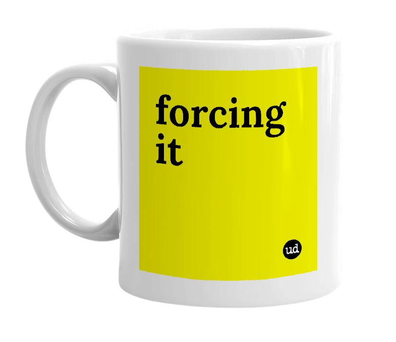 White mug with 'forcing it' in bold black letters