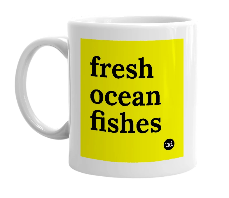 White mug with 'fresh ocean fishes' in bold black letters